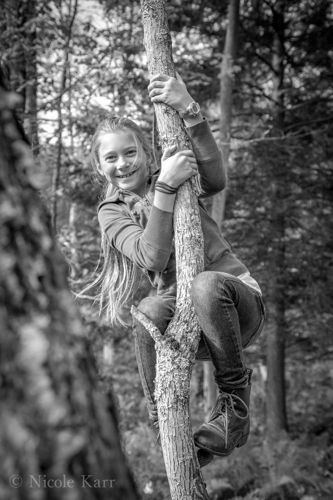 girl climbing tree